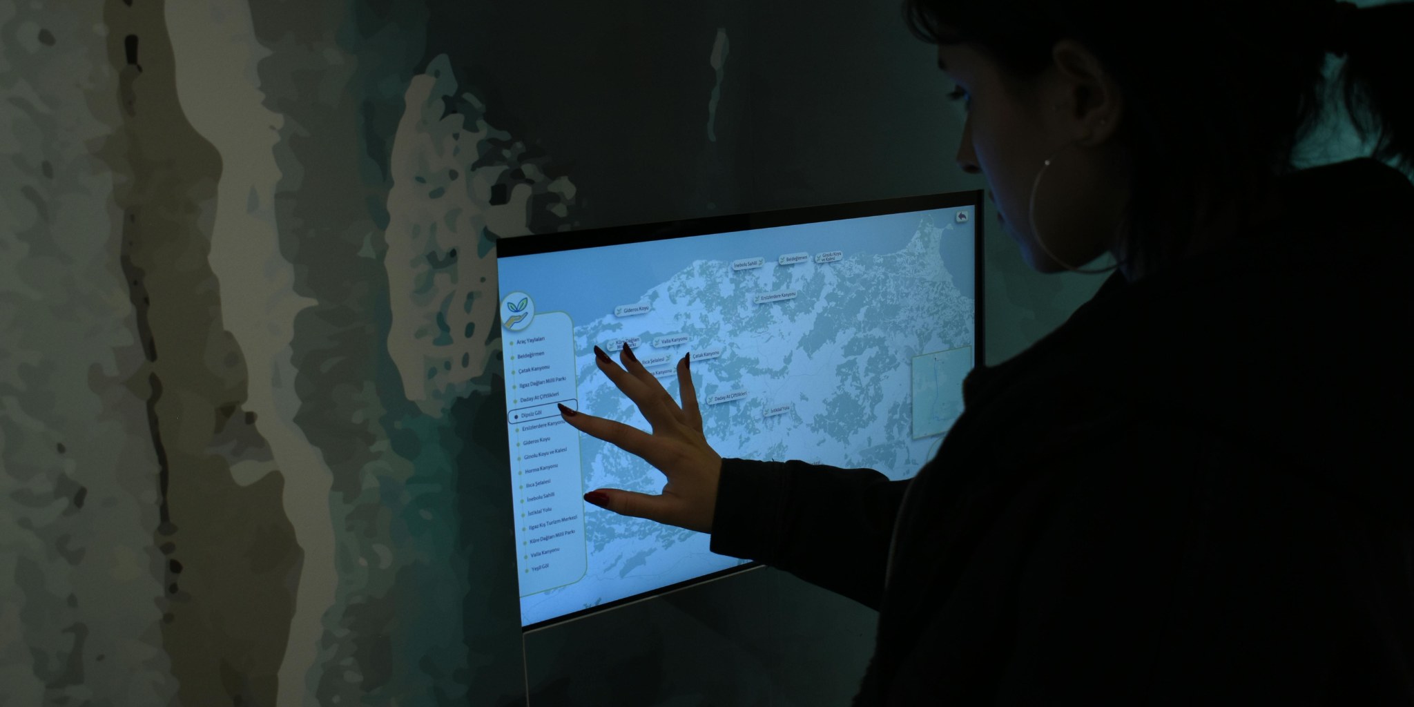 AI & Automation — a person working at a large touchscreen display