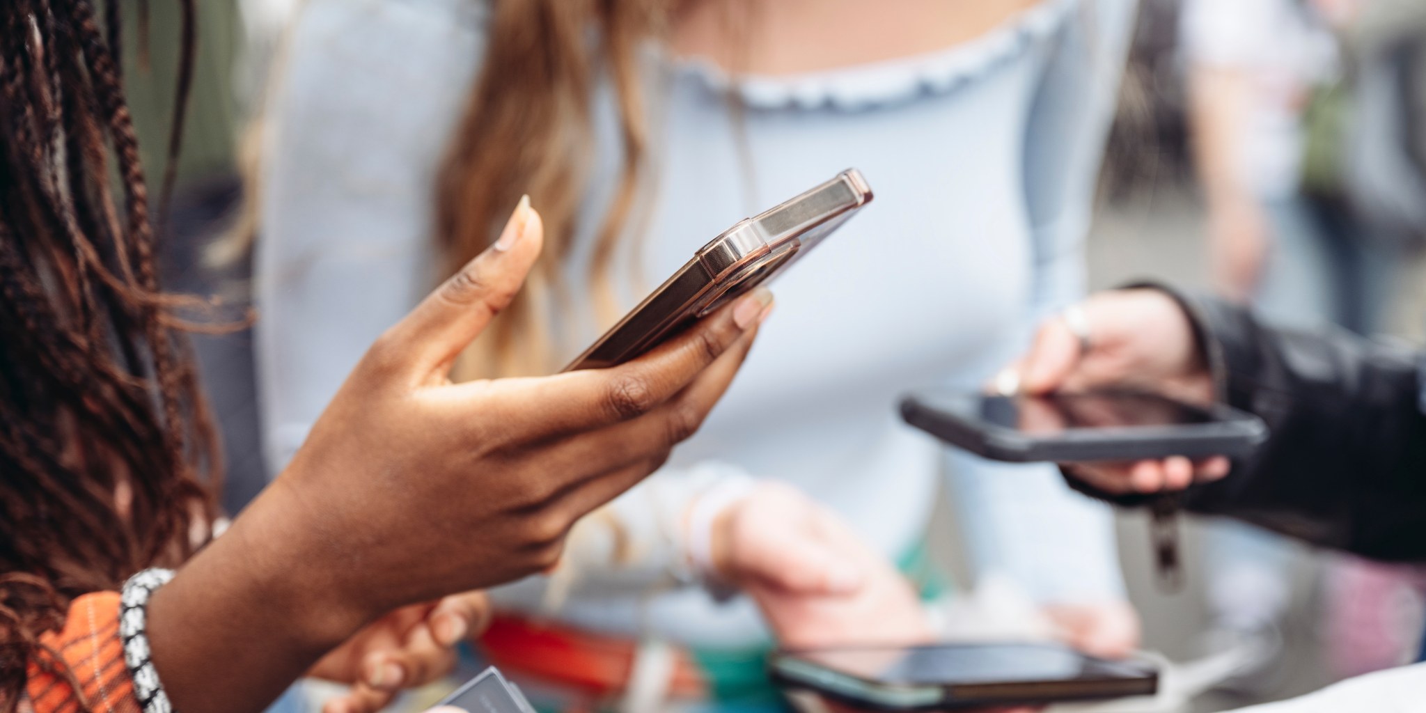 Product — hands using an app on a phone, the point of building something people actually use