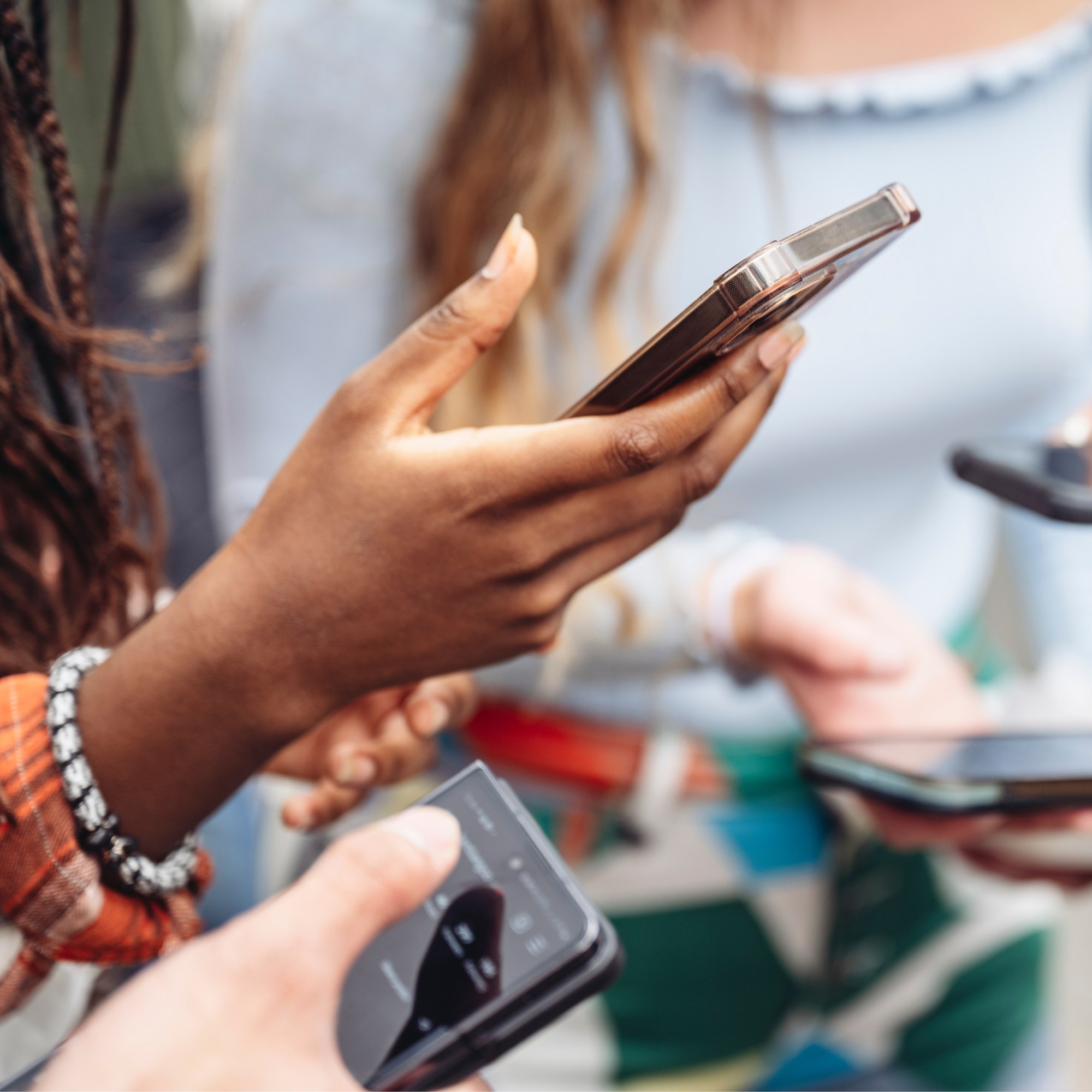 Product — hands using an app on a phone, the point of building something people actually use